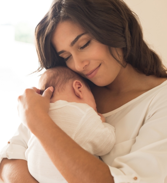 A mother holding her baby picture